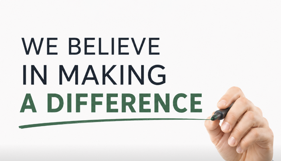Hand with marker writing we believe in making a difference