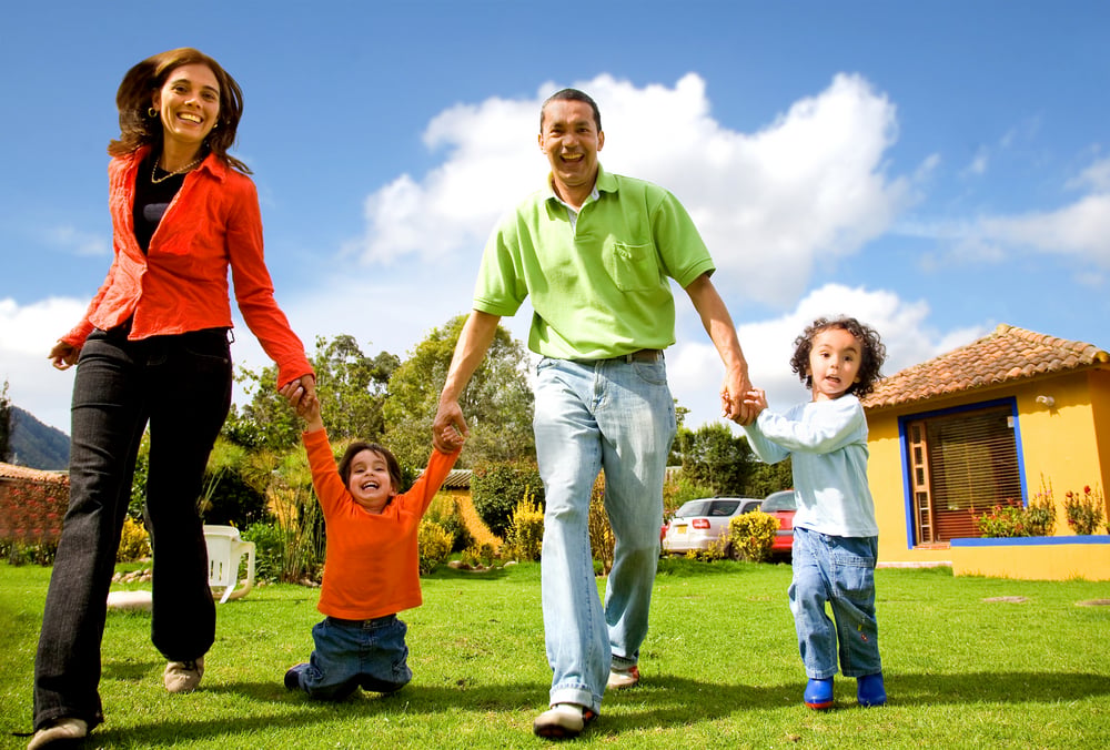 happy family having fun outdoors at home on a sunny day